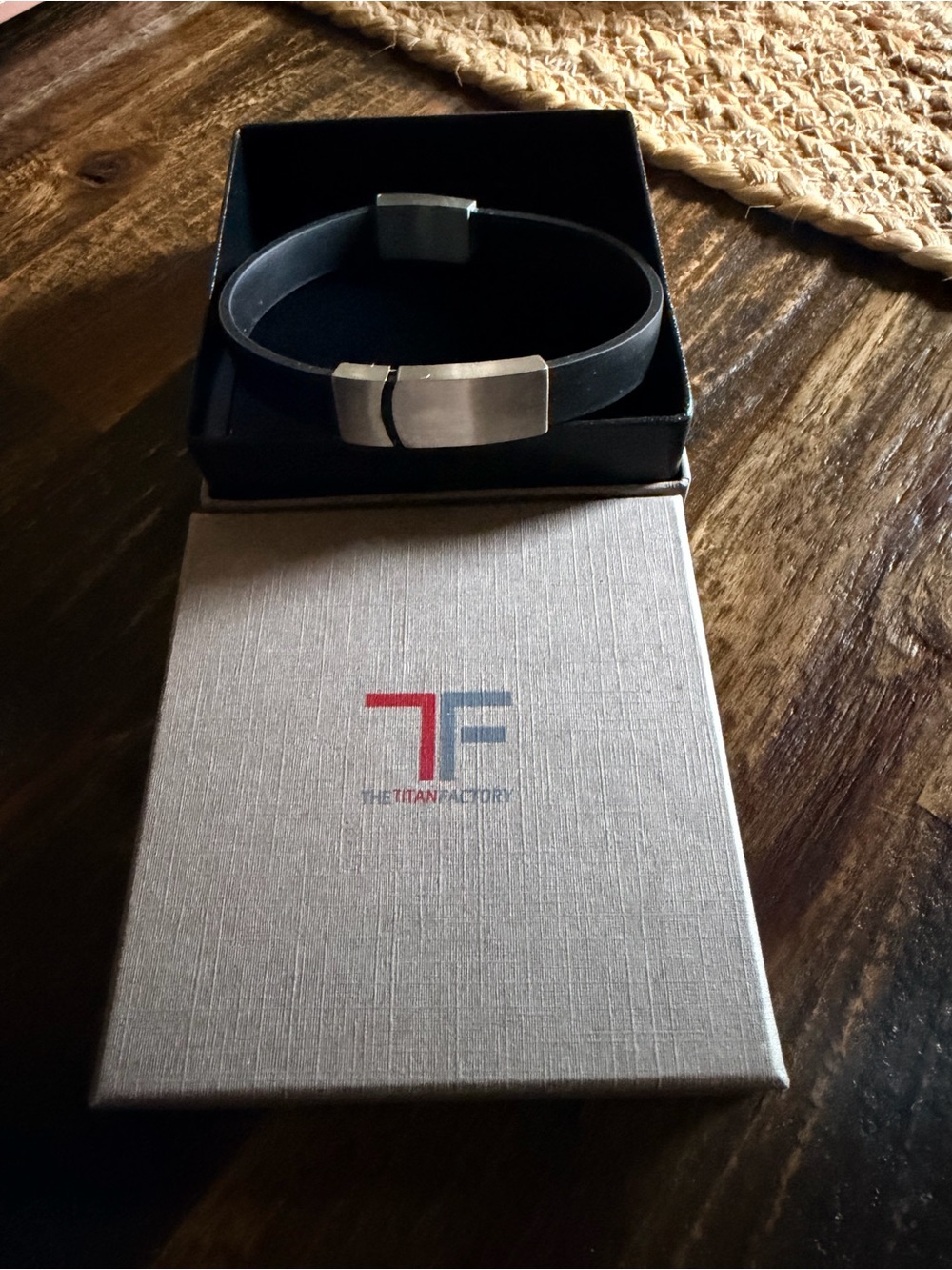 Never Worn - The Titian men’s black adjustable bracelet with silver plate.